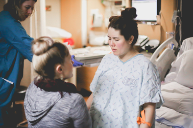 Tiffany Wilson, Puget Sound Doula assisting a client in a hospital.